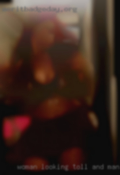 Woman looking toll and man milf short haircots.